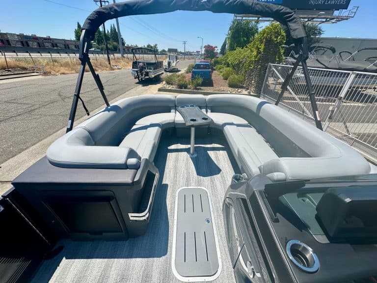Inflatable boat with comfortable seating, canopy, and durable design for recreational water activiti.