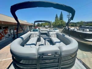 Inflatable boat with spacious seating and canopy, ideal for water sports, fishing, and family outing.