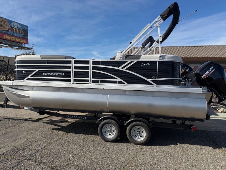 Bennington 20SSR pontoon boat with outboard motor and wakeboard tower.