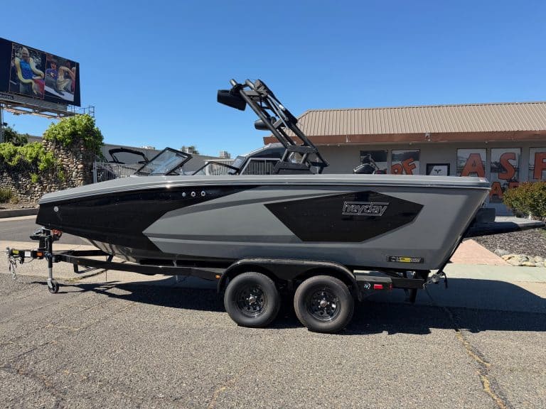 High-performance 2026 Heyday WT2 surf boat on trailer. Perfect for water sports and family fun.