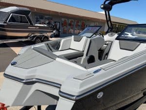 Modern 2026 Heyday WT2 DC surf boat with seating and wakeboard tower.
