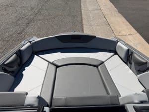 Modern surf boat with spacious seating and sleek design for water sports.
