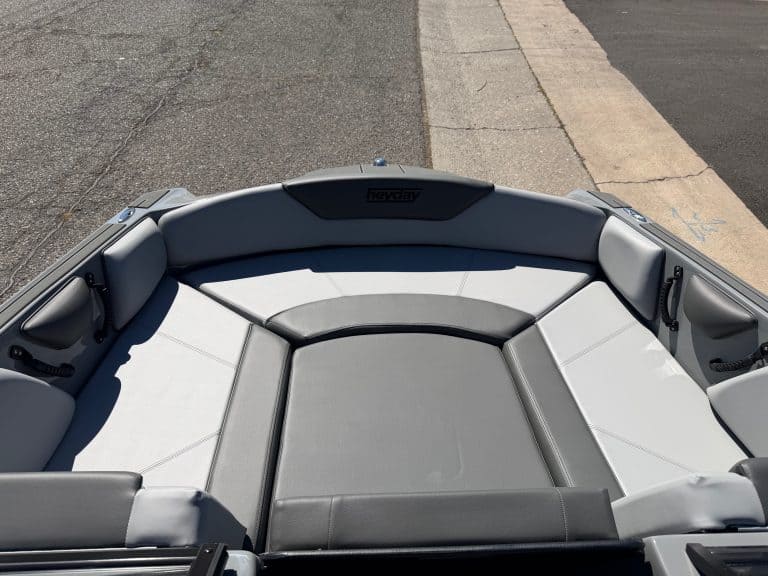 Modern surf boat with spacious seating and sleek design for water sports.