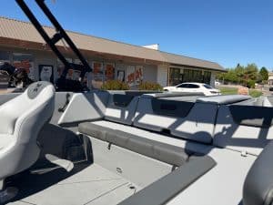 Modern 2026 Heyday WT2 DC surf boat with seating and wakeboard tower.