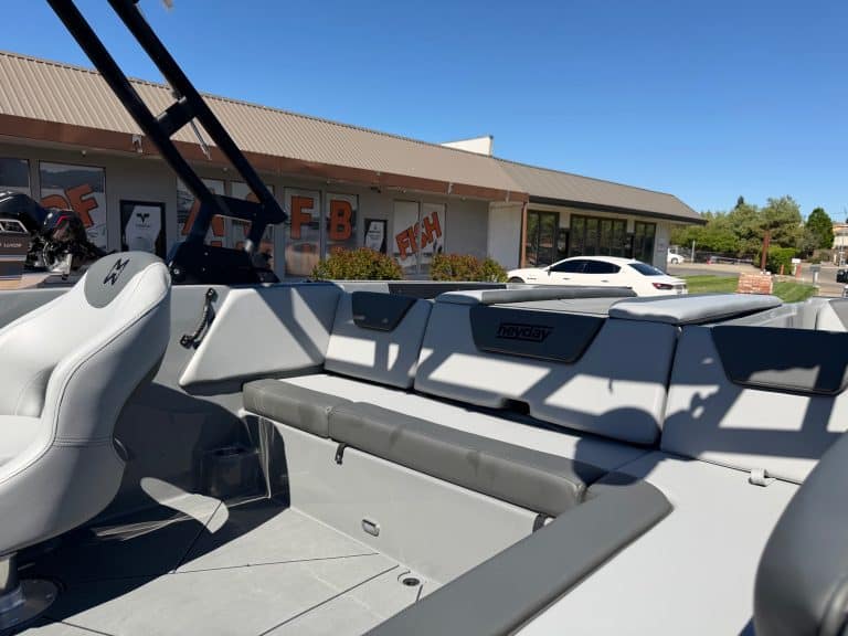 Modern 2026 Heyday WT2 DC surf boat with seating and wakeboard tower.