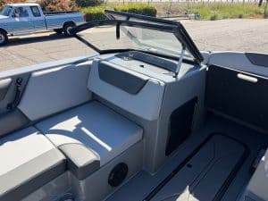 Interior view of the 2026 Heyday WT2 DC surf boat with seating and windshield.