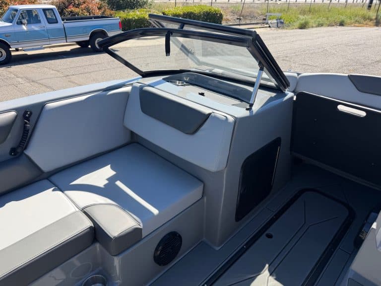 Interior view of the 2026 Heyday WT2 DC surf boat with seating and windshield.