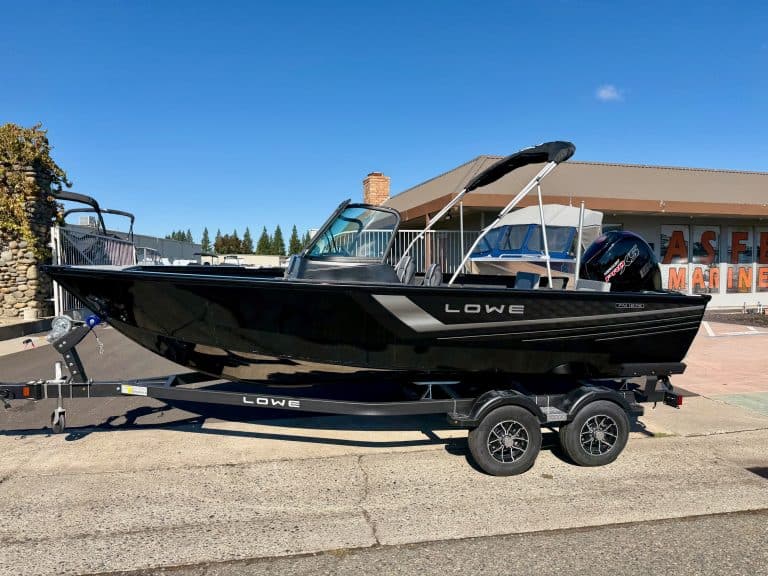 Lowe FM 1875 fishing boat with 150HP engine on trailer.