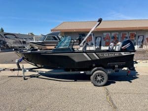 Lowe FM 1675 WT boat with Mercury outboard engine on trailer.