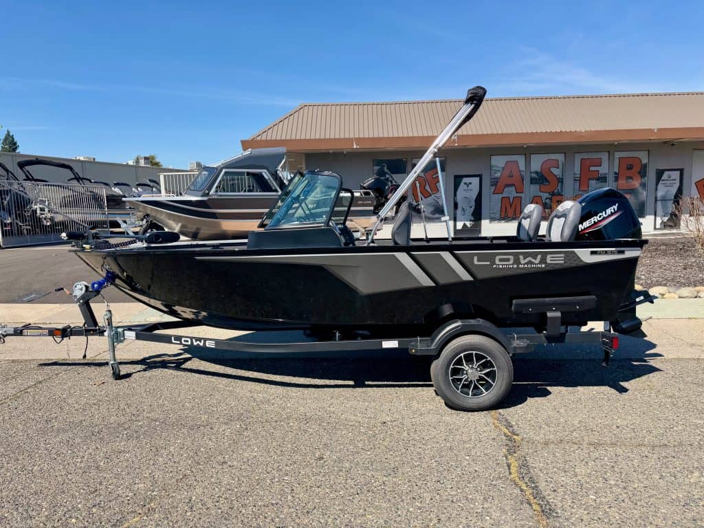 Lowe FM 1675 WT boat with Mercury outboard motor on trailer.