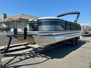 Pontoon boat with Mercury 150HP engine for leisure and fishing.