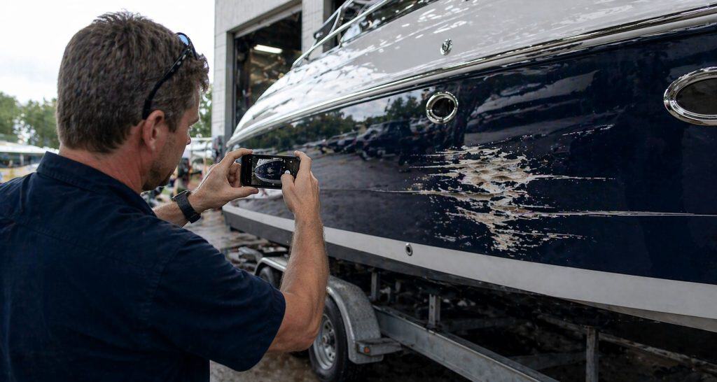 Boat hull damage inspection for insurance and warranty repair services.