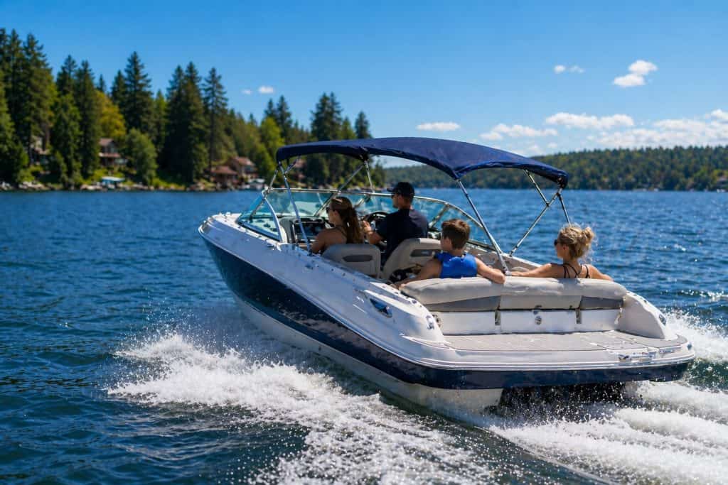Boat on lake with family, highlighting reliable engine performance after service.
