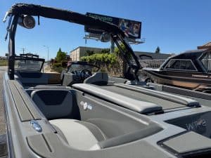 Modern 2026 Heyday WT2 DC surf boat with seating and wakeboard tower.