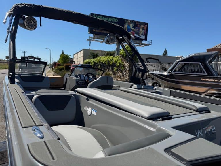 Modern 2026 Heyday WT2 DC surf boat with seating and wakeboard tower.
