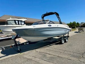 Modern Bayliner VR6 boat on trailer, ideal for recreational boating.