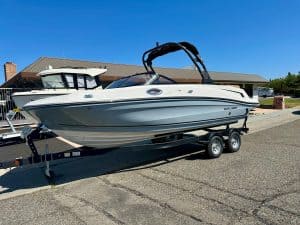 Modern Bayliner VR6 boat on trailer, ready for water adventures.