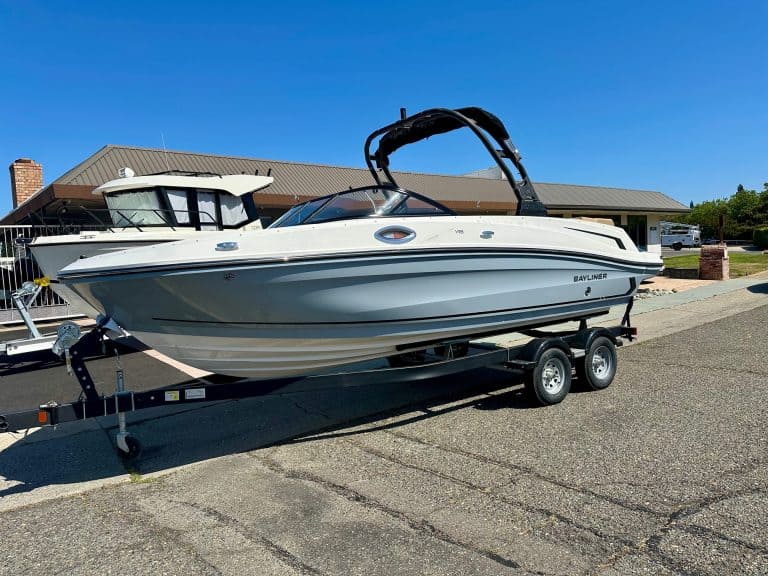 Modern Bayliner VR6 boat on trailer, ready for water adventures.