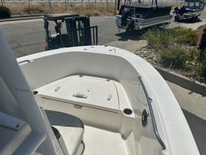 Close-up of the interior of a Robalo R 180 boat with seating and storage.