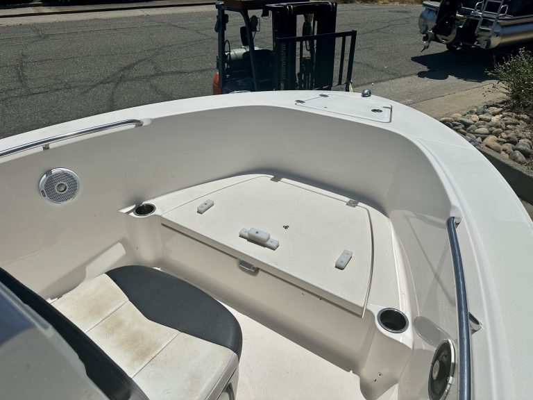 Close-up of the interior of a Robalo R 180 boat with seating and storage.