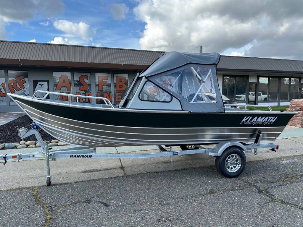 High-quality Klamath 18FT OPW fishing boat on trailer, ideal for freshwater and saltwater fishing ad.