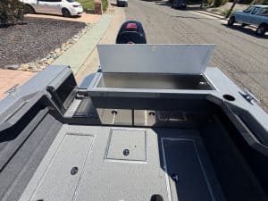 Secure storage compartment on the 2026 Thunder Jet Luxor boat with Mercury 150HP engine.