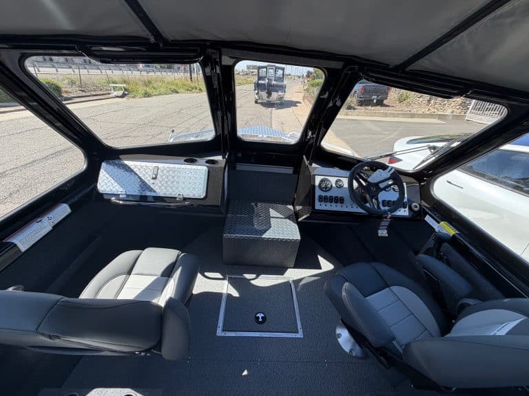High-quality boat cockpit with steering wheel and control panel.