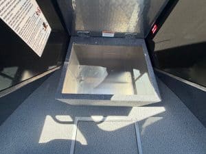 Boat storage compartment with open lid on a Thunder Jet Luxor 185 Mercury 150HP.