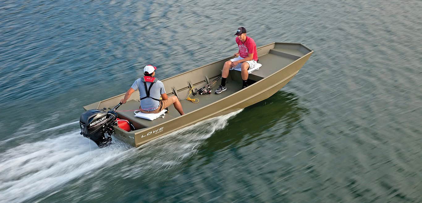 Two people enjoying a boat ride on calm waters with a small motorboat.
