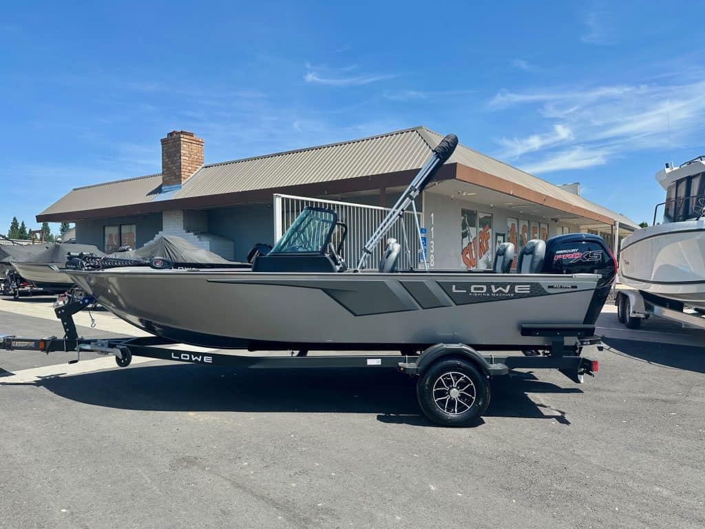 Modern Lowe boat with outboard motor on trailer at ASFB Marine dealership.
