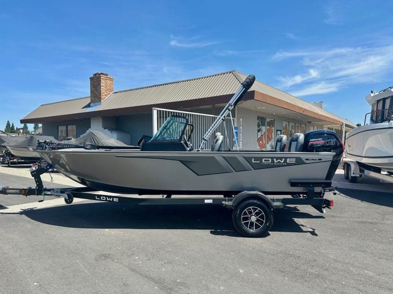 Modern Lowe boat with outboard motor on trailer at ASFB Marine dealership.