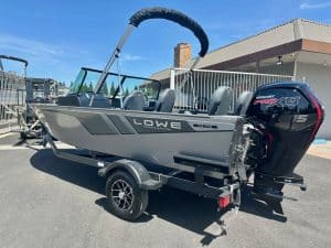 Lowe boat with Mercury outboard motor on trailer, ready for water. Perfect for fishing and leisure a.