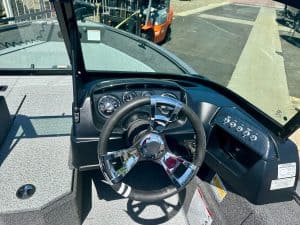 Boat steering wheel and dashboard for marine vessel.