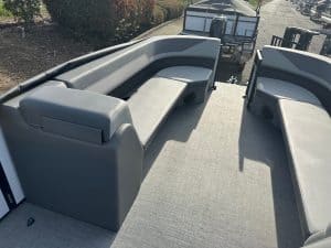 Pontoon boat seating with comfortable cushions for relaxing on the water.