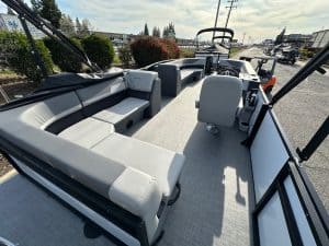 Luxury pontoon boat interior with spacious seating and modern controls for optimal boating experienc.