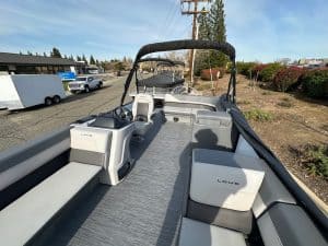 Modern boat interior with comfortable seating and navigation area.