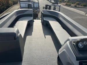 Pontoon boat interior with comfortable seating and modern features for leisure boating.