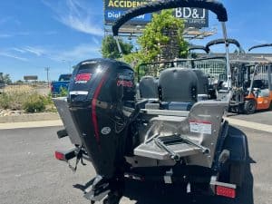 Boat with Mercury outboard engine and seating, ideal for fishing and water adventures.