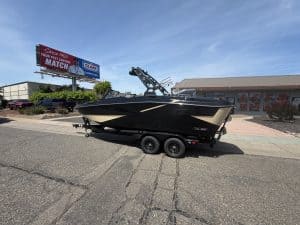 High-performance HeyDay H 22 surf boat on trailer for sale.