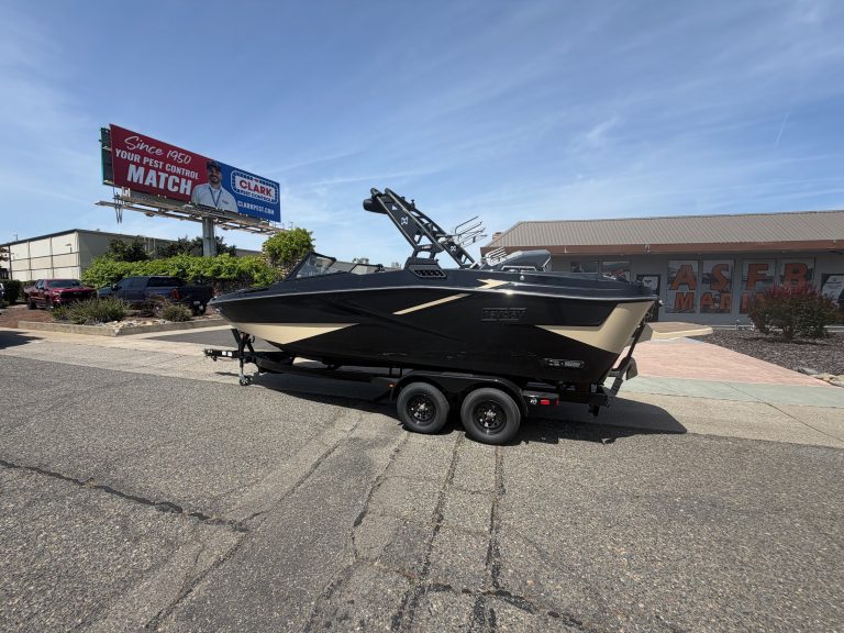 High-performance HeyDay H 22 surf boat on trailer for sale.