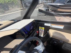 Modern boat dashboard with digital controls and navigation system.