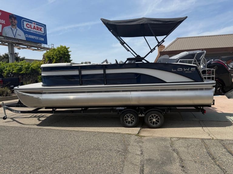 Pontoon boat with canopy for leisure and water sports.