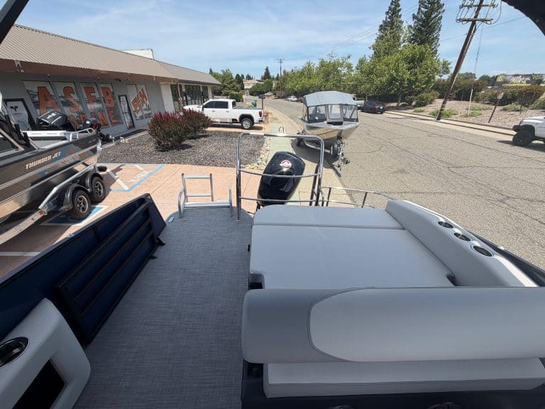 Marine boat dealership with new boats, accessories, and outdoor display area.