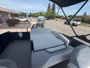Boat deck with seating area and canopy.