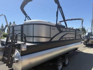 Modern pontoon boat with canopy, ideal for leisure and water activities.
