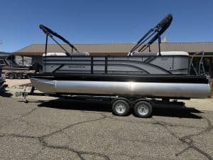 Modern pontoon boat with dual Bimini tops, perfect for leisure and water sports.