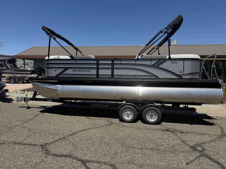 Modern pontoon boat with dual Bimini tops, perfect for leisure and water sports.