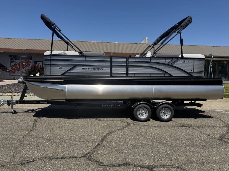 Bennington pontoon boat with dual Bimini tops and modern design.