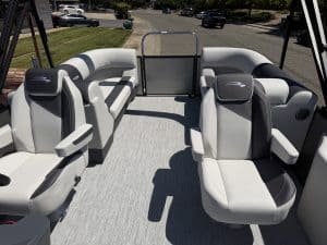Pontoon boat with plush, ergonomic seating for leisure and entertainment.