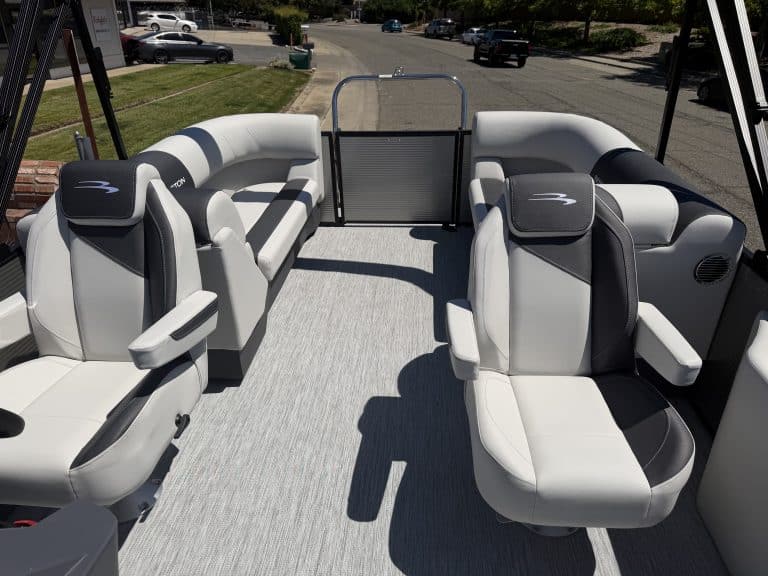 Pontoon boat with plush, ergonomic seating for leisure and entertainment.